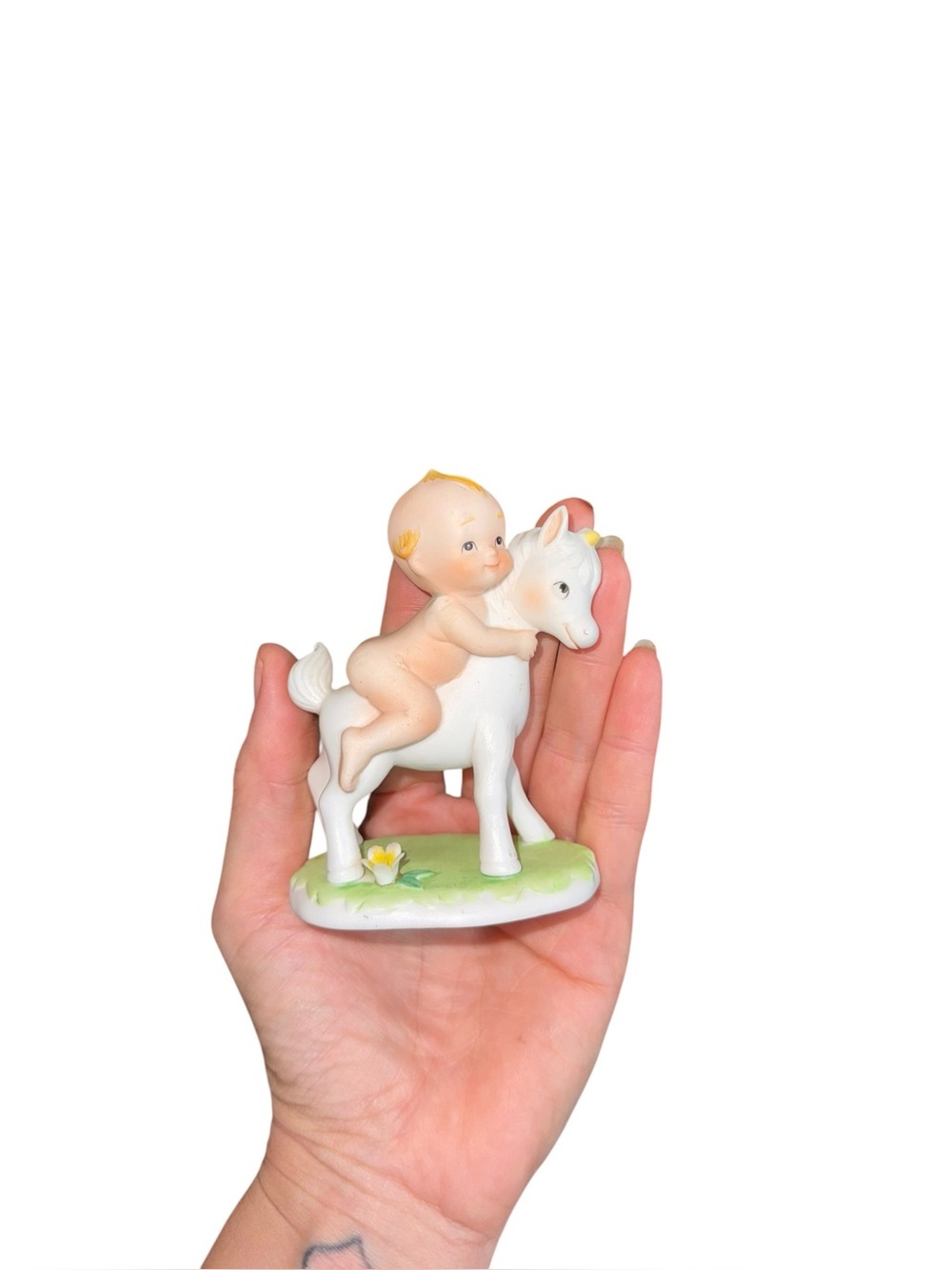 Vintage Lefton kewpie on unicorn figurine